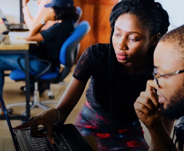 African American Man And Woman Work At A Laptop Computer Thumbnail