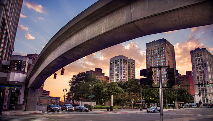 The public transportation system known as the People Mover propels itself along this monorail as seen on Woodward Avenue in Detroit Michigan. There is massive urban renewal in downtown Detroit following years of economic uncertainty associated with its insolvency of several years ago.