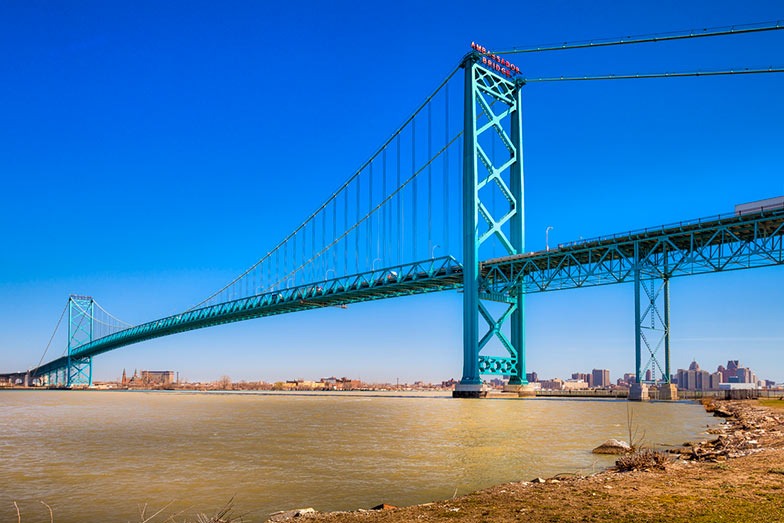The Ambassador Bridge spans the Detroit River between Windsor Ontario Canada and Detroit Michigan, USA.