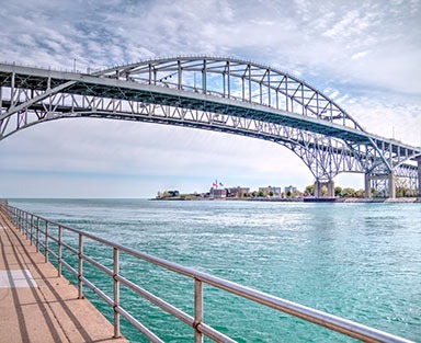 The twin spans of the Blue Water Bridges connect the cities of Port Huron, Michigan and Sarnia, Ontario.  They are the second busiest crossing between the US and Canada.