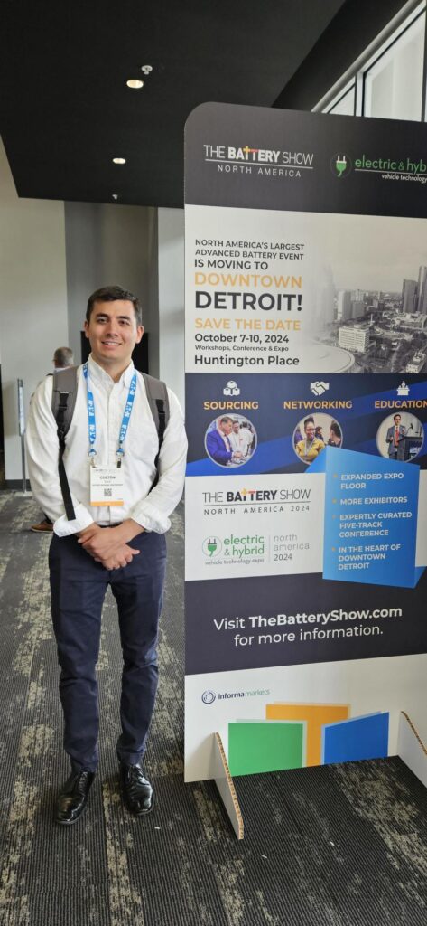 Man standing in front of a vertical banner