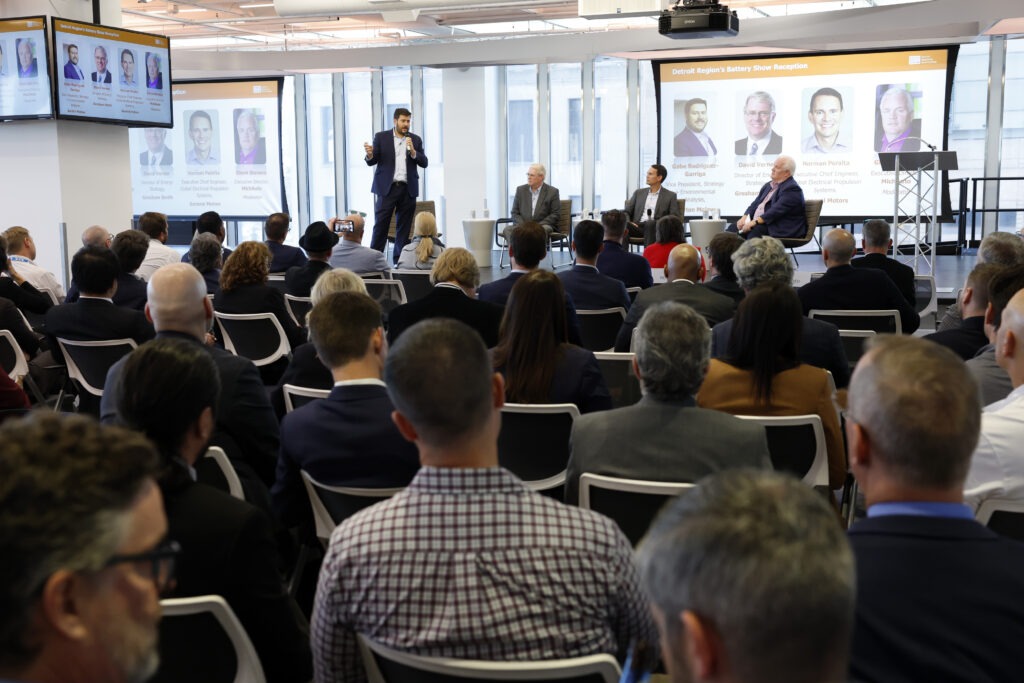 View of a crowd watching a panelist speak