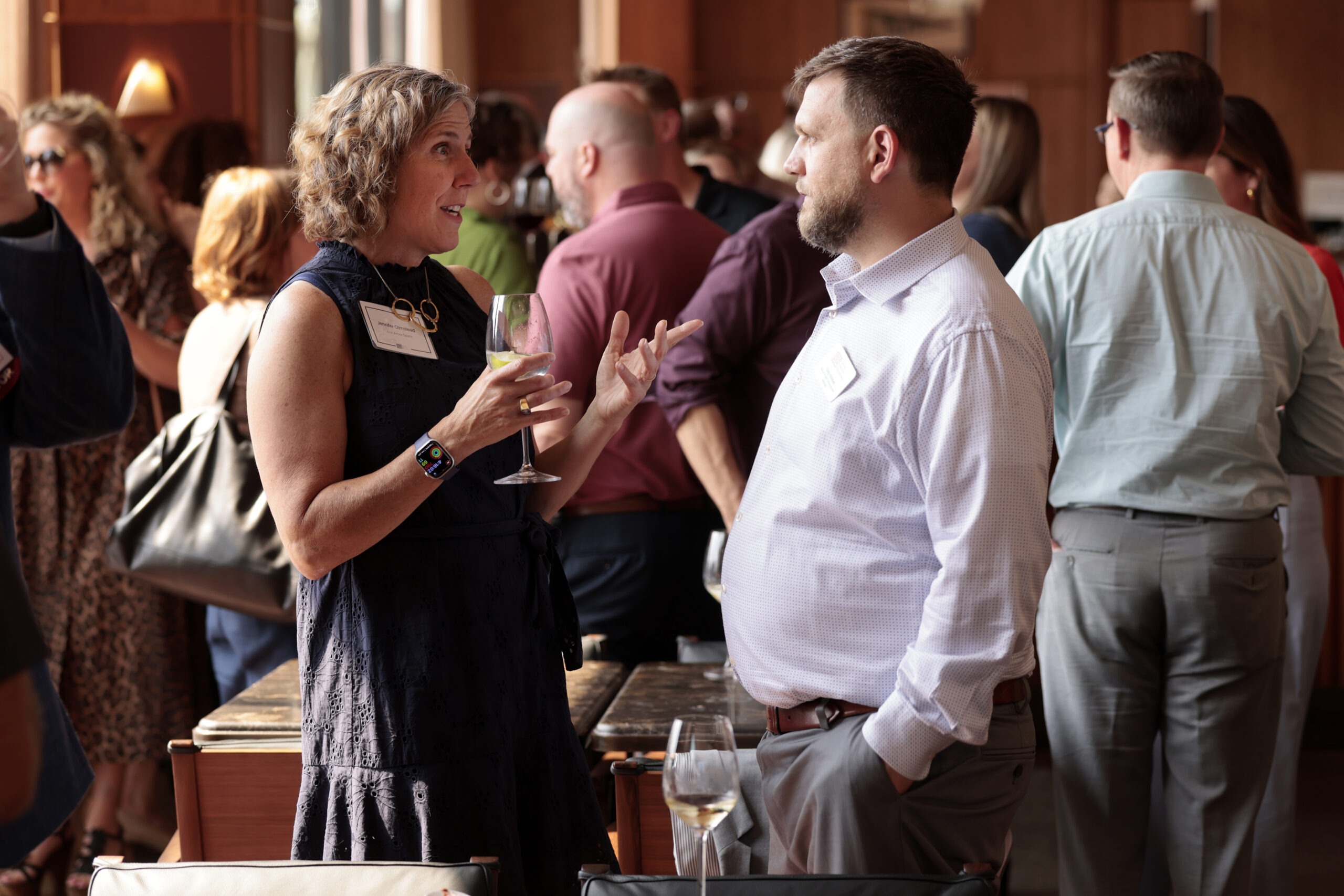 Two people talking at a networking event