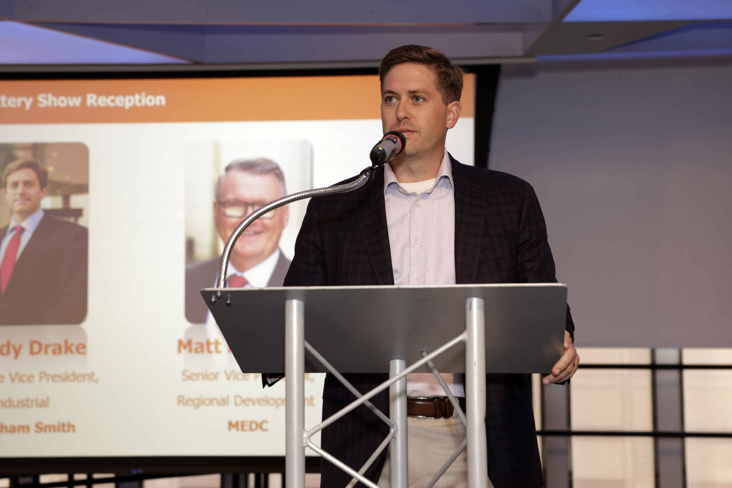 Man speaking at a podium