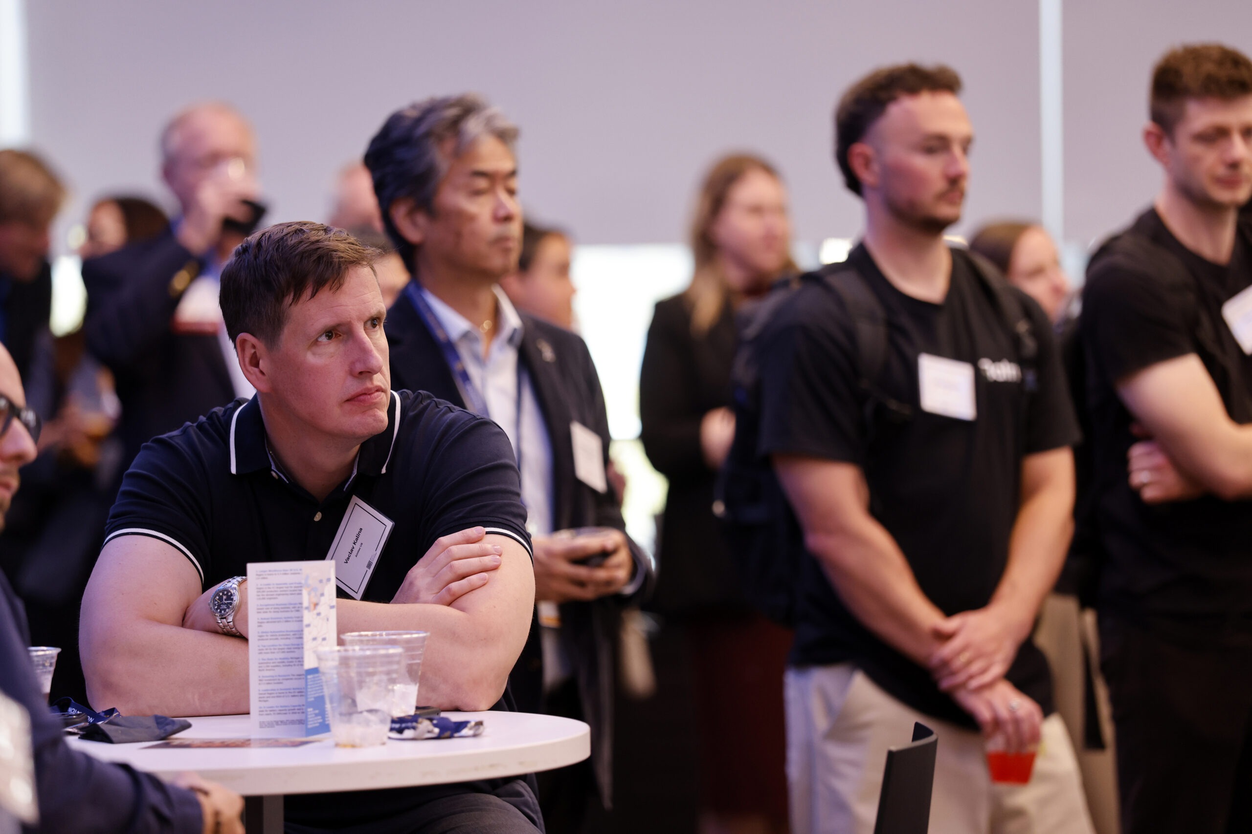 Room of people listening to a speaker